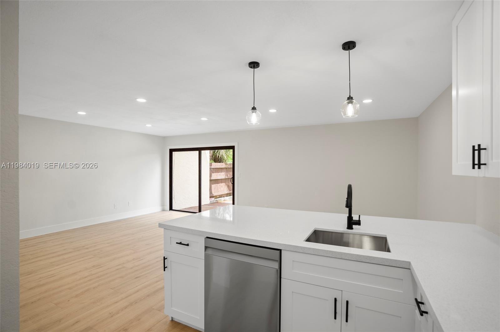 28015 Southwest 143rd Court Homestead, FL 33033 - Photo 2 of 29 a kitchen with a sink and window