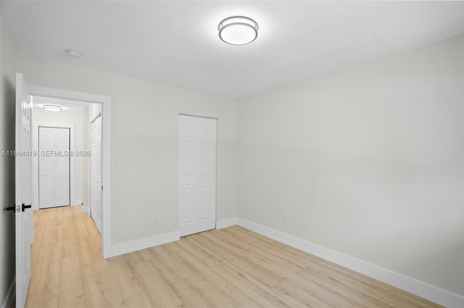 28015 Southwest 143rd Court Homestead, FL 33033 - Photo 24 of 29 a view of room with wooden floor