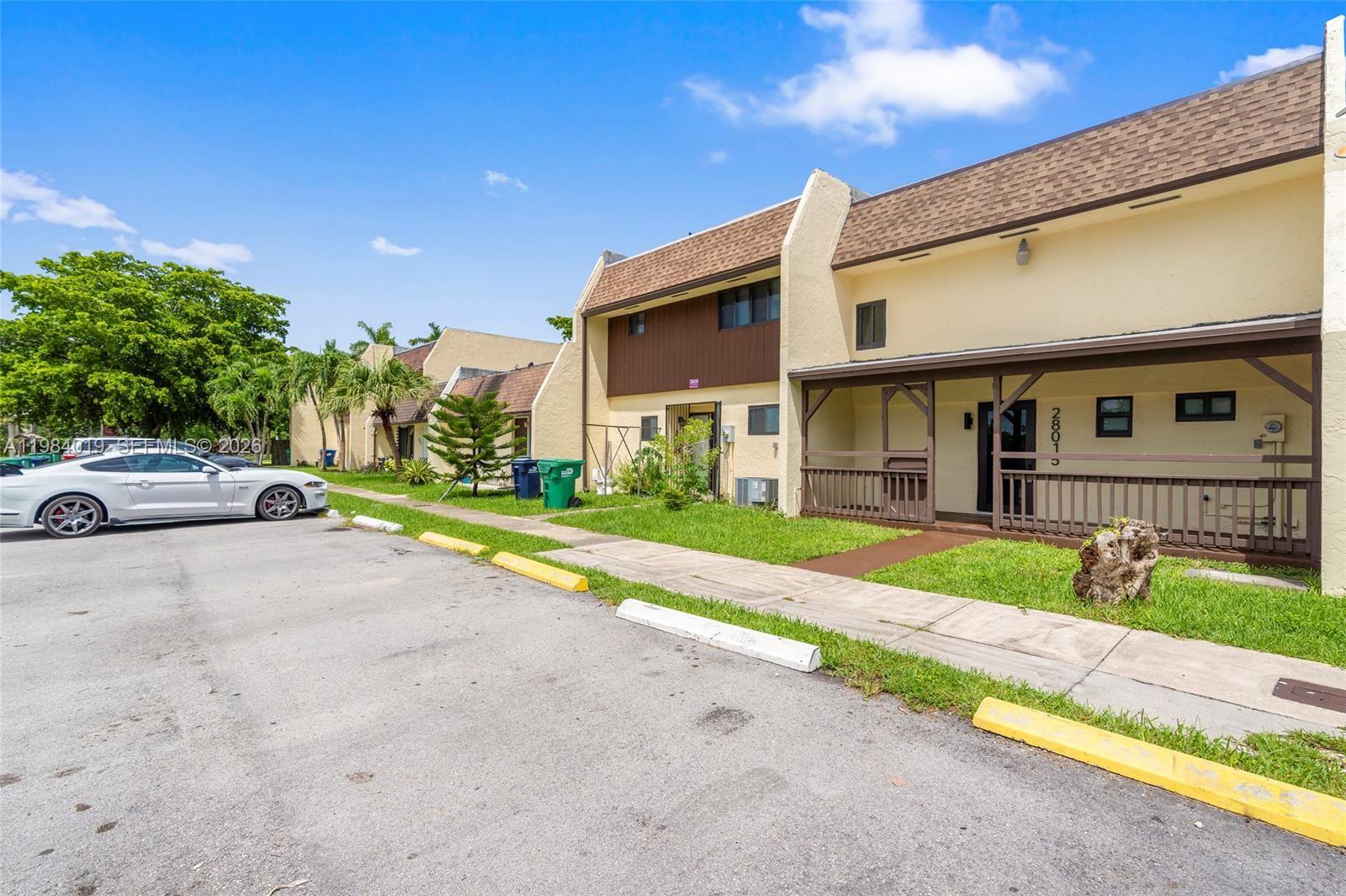 28015 Southwest 143rd Court Homestead, FL 33033 - Photo 25 of 29 a house view with a garden space