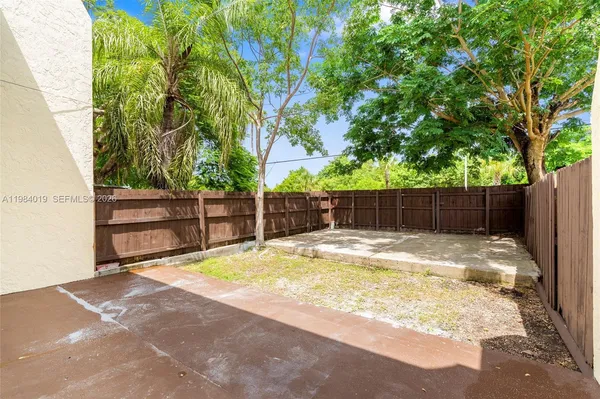 a view of small space with wooden fence