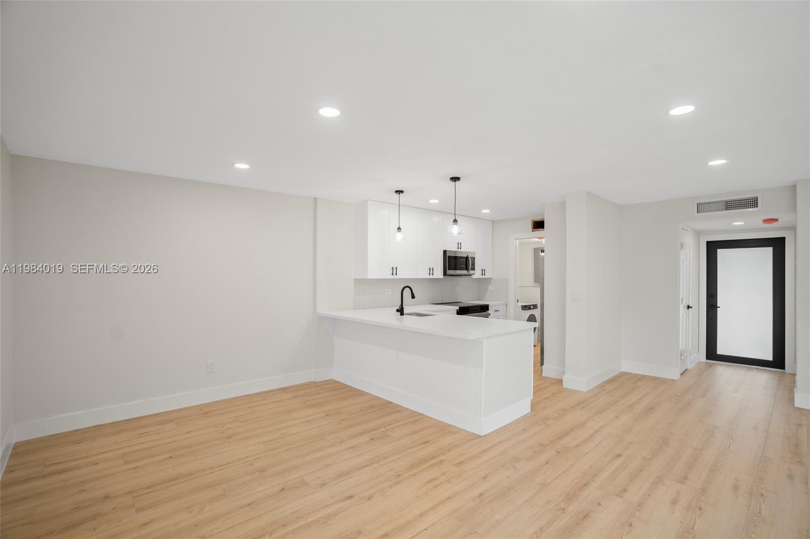 28015 Southwest 143rd Court Homestead, FL 33033 - Photo 10 of 29 a view of a kitchen with sink stainless steel appliances and cabinets