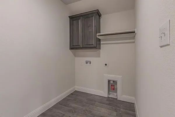 an empty room with a ceiling fan and a window