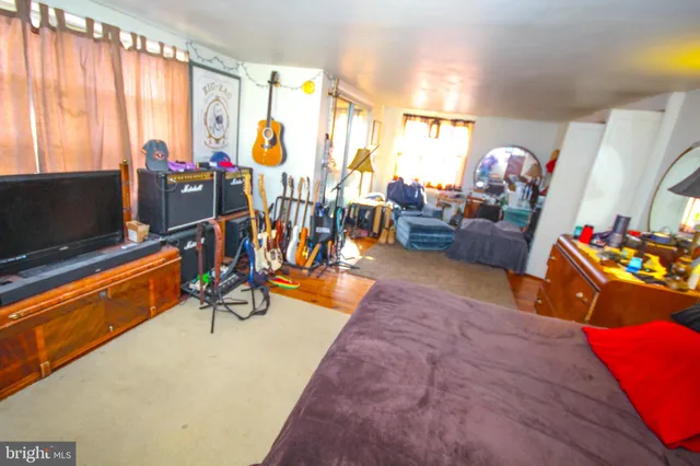 a living room filled with furniture and a chandelier