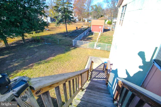 a view of balcony with wooden floor