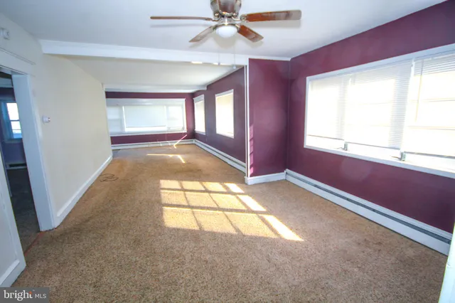 a view of hallway with windows