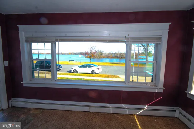 a view of a living room and floor to ceiling window