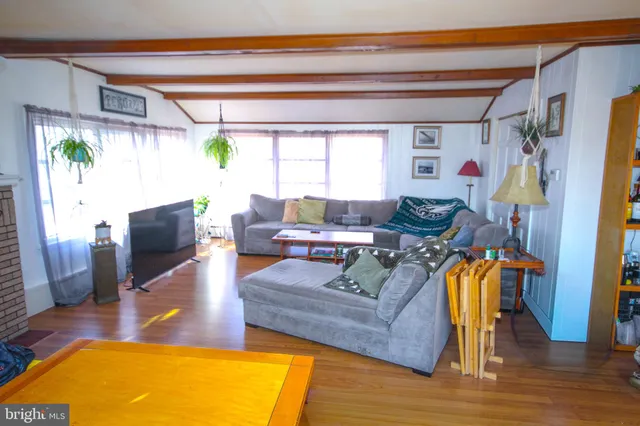 a living room with furniture and a table