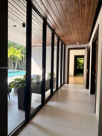 a bathroom with a granite countertop sink a mirror and a shower