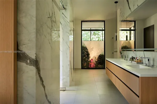 a bathroom with a double vanity sink and a mirror