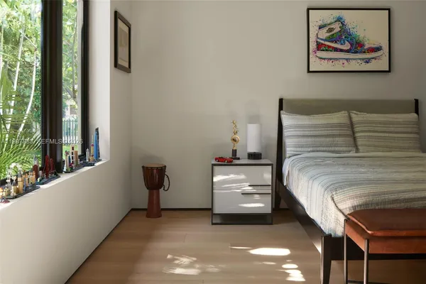 a view of a workspace with pool table and chairs