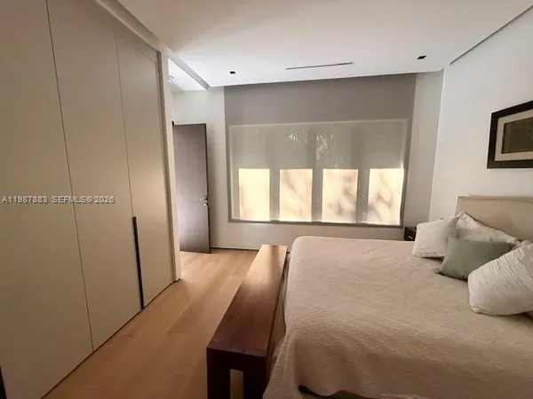 a view of a house with swimming pool and furniture