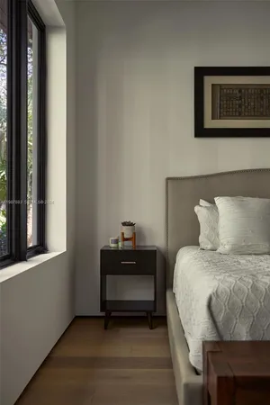 a front view of a house with plants