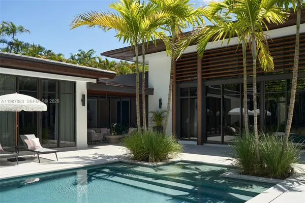 a view of a patio with table and chairs potted plants with wooden fence