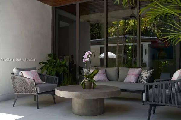 a view of a house with a large tree