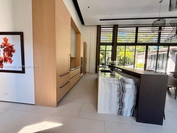 a bed sitting in a room next to a window