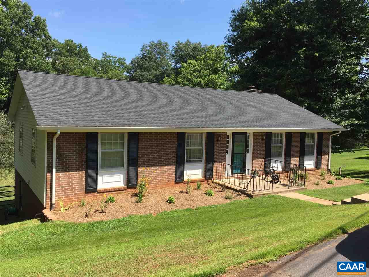 a front view of house with yard and outdoor seating