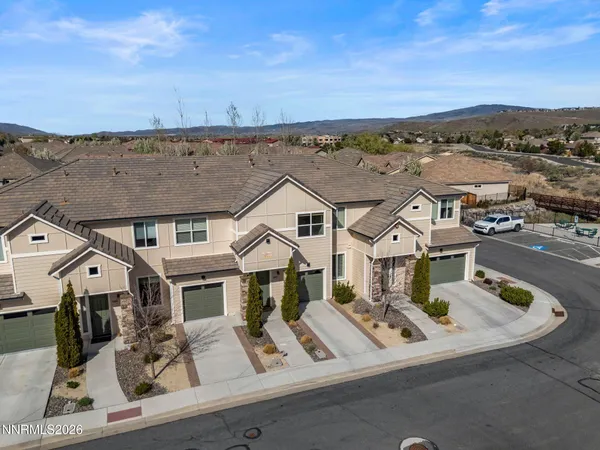 a view of a patio with table and chairs and potted plants