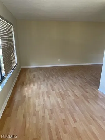 a view of room with wooden floor