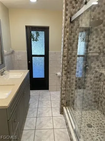 a bathroom with a bathtub and shower