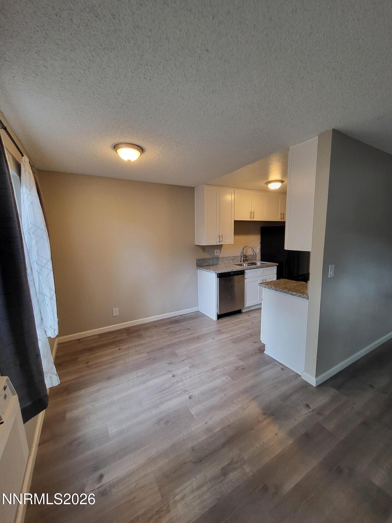 4606 Neil Road, Unit 197 Reno, NV 89502 - Photo 18 of 26 a view of kitchen and microwave