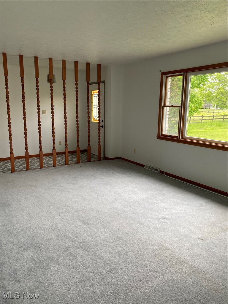 36889 Capel Road Grafton, OH 44044 - Photo 3 of 26 Carpeted empty room featuring baseboards