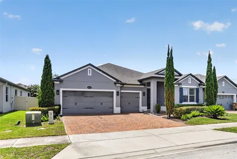 a front view of a house with a garden and entryway