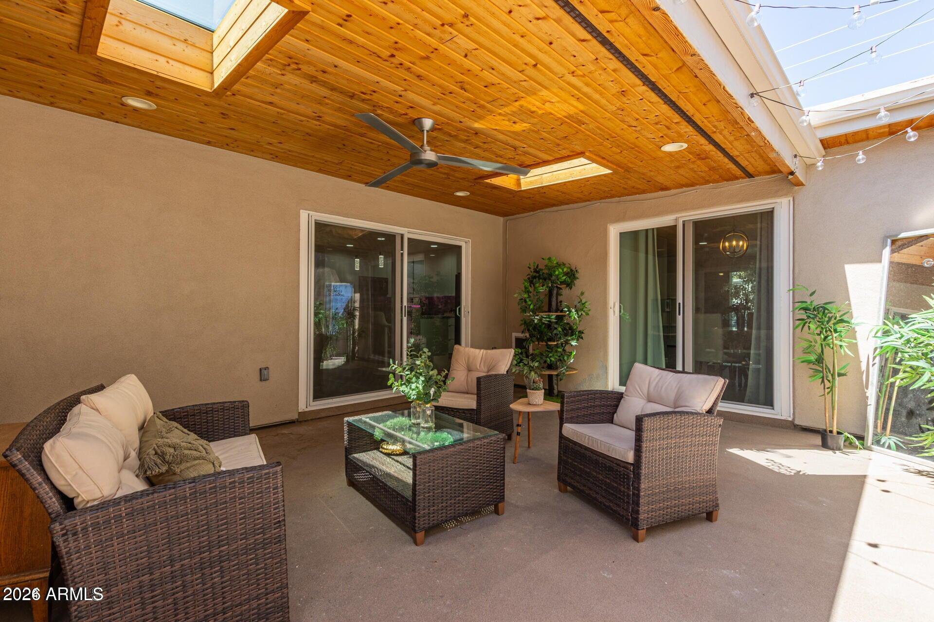 5913 East Thomas Road Scottsdale, AZ 85251 - Photo 2 of 26 a outdoor living space with furniture and garden
