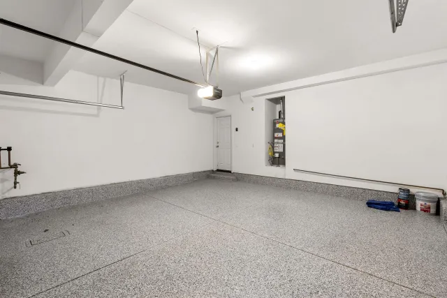 a view of a room with rack and a ceiling fan