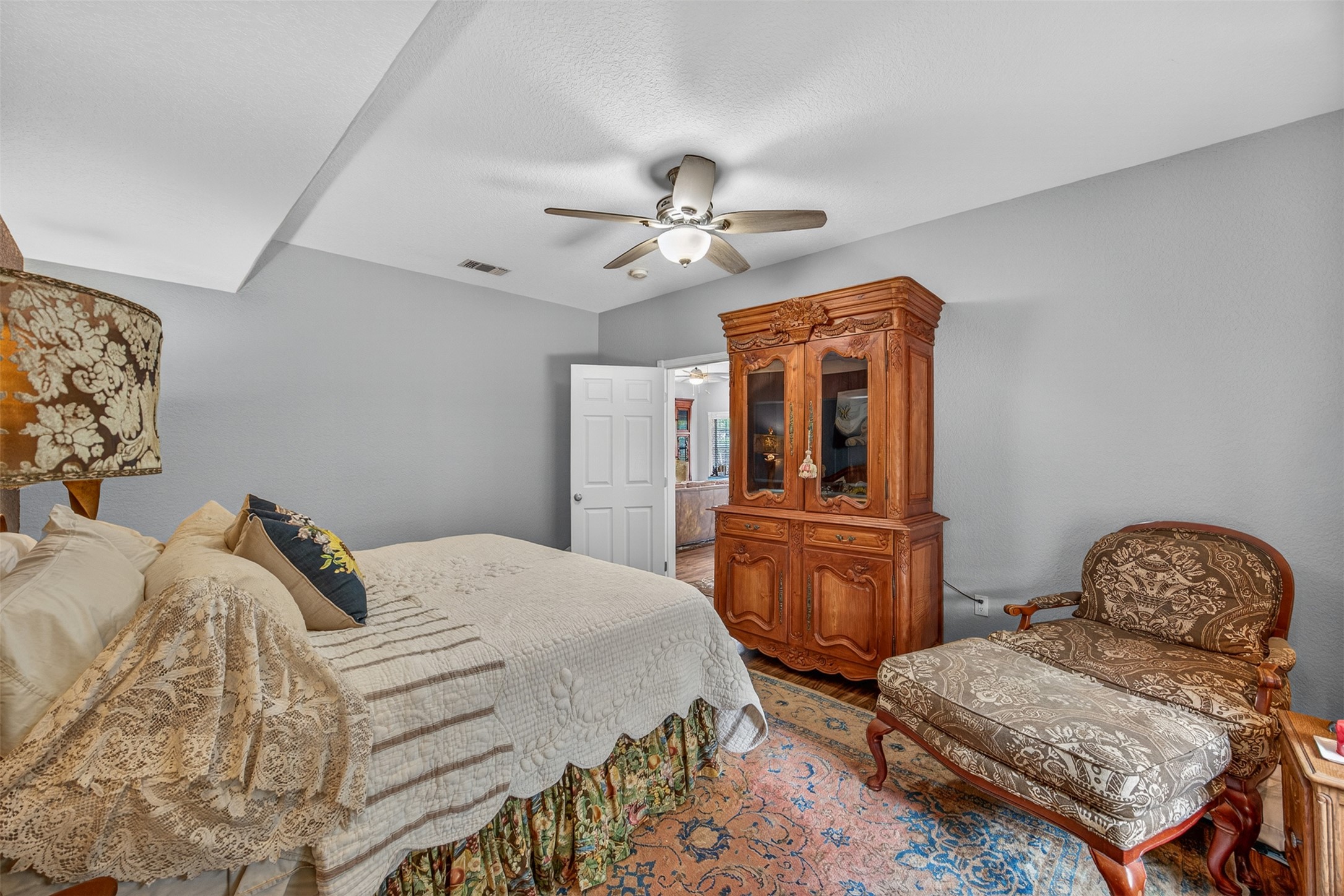 217 Walnut Avenue Luling, TX 78648 - Photo 15 of 38 a bedroom with a bed and furniture