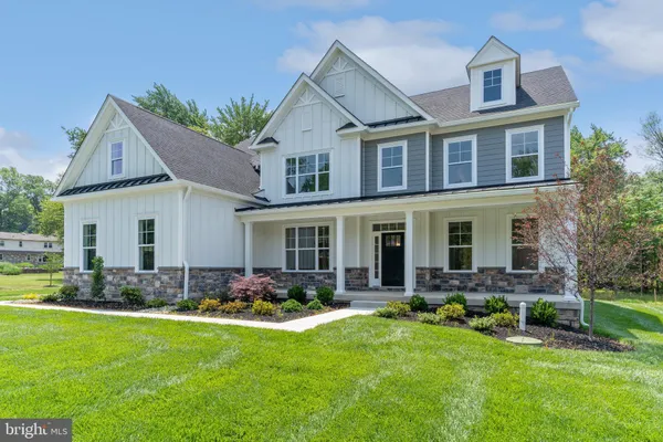 a front view of house with yard and outdoor seating