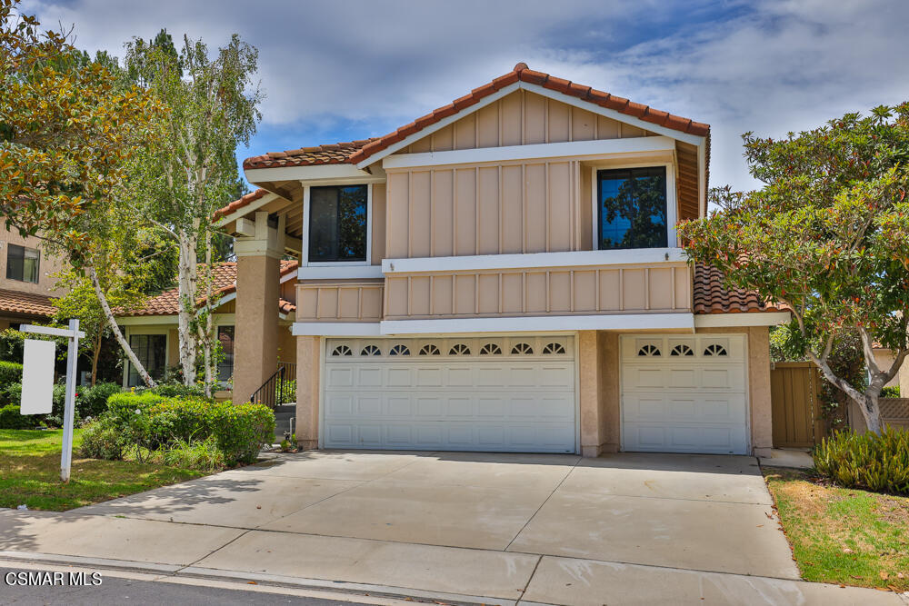 4035 Cliffrose Avenue Moorpark, CA 93021 - Photo 2 of 43 a front view of a house with a yard and garage