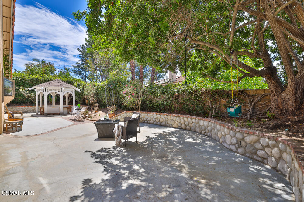 4035 Cliffrose Avenue Moorpark, CA 93021 - Photo 35 of 43 a view of a patio with couches and table and chairs and potted plants