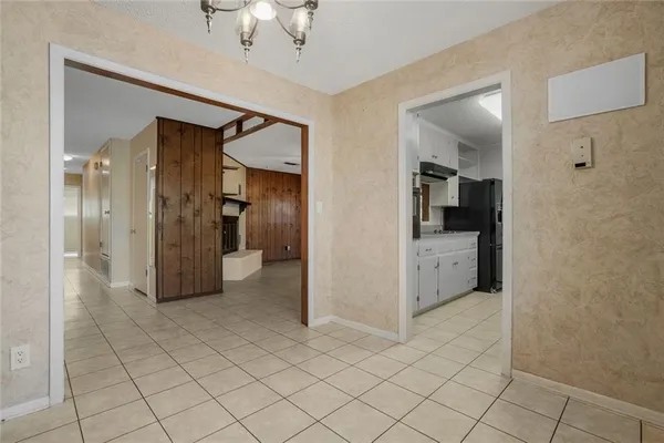 a kitchen with a sink appliances and cabinets