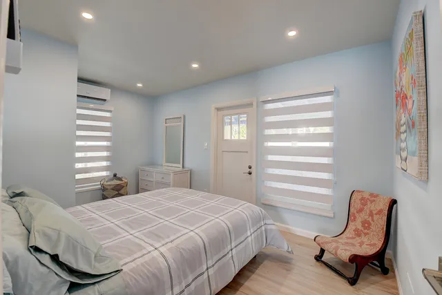 a bedroom with a bed and a chair