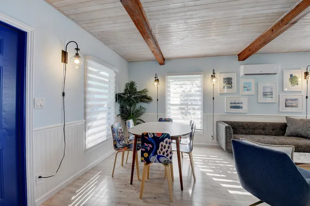 a dining room with furniture and window