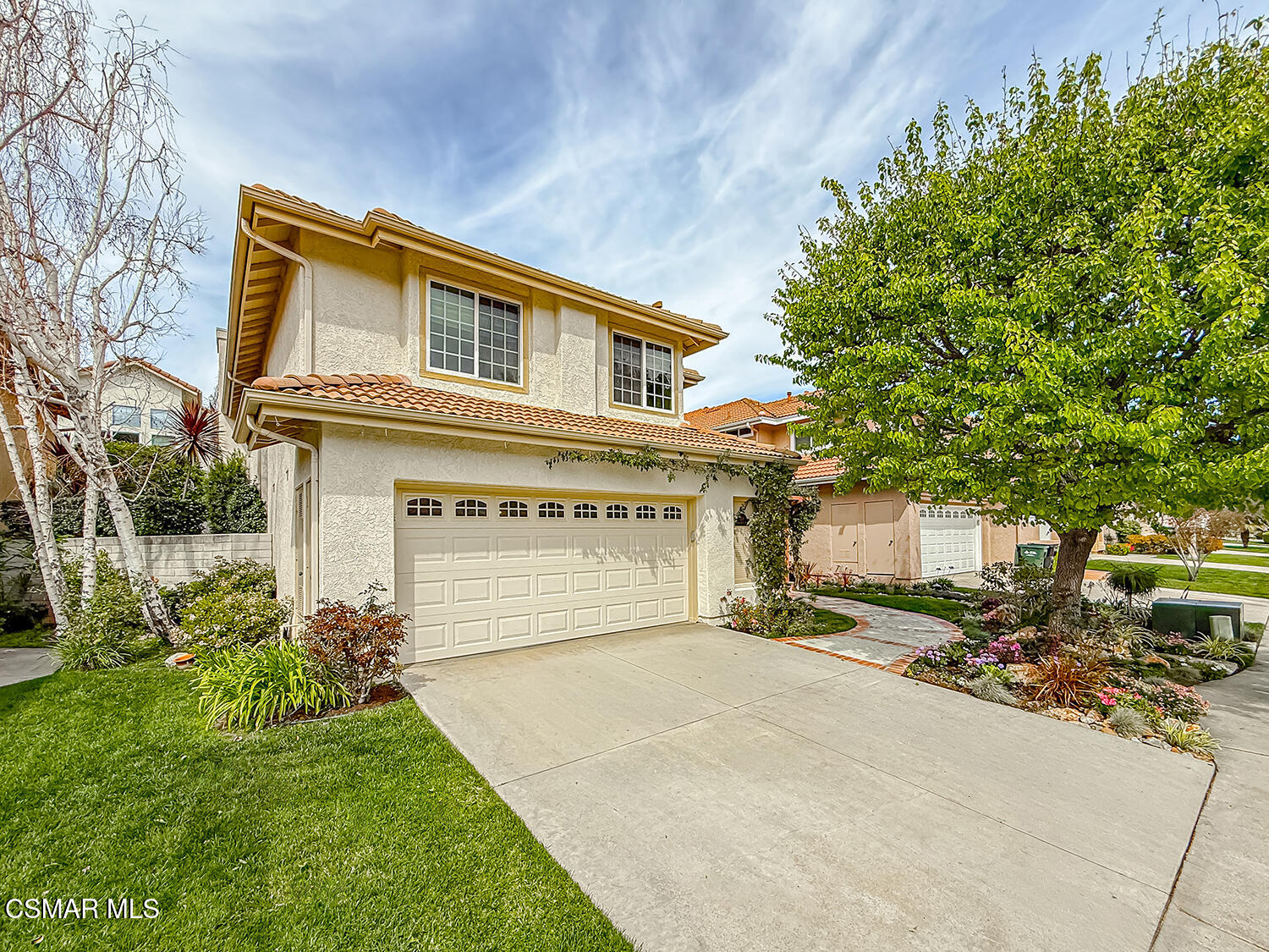 219 Ocho Rios Way Oak Park, CA 91377 - Photo 1 of 1 a front view of a house with a yard and garage