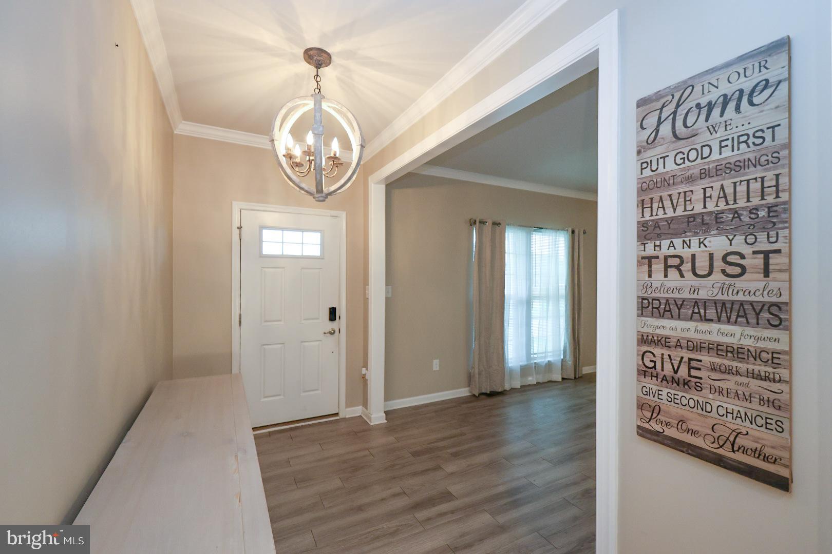 152 Tywyn Drive Middletown, DE 19709 - Photo 2 of 25 a view of a hallway with wooden floor and a large window