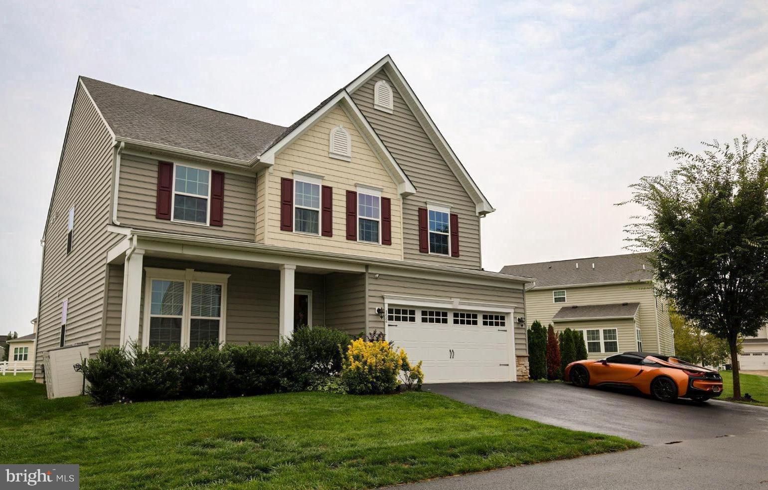 152 Tywyn Drive Middletown, DE 19709 - Photo 24 of 25 a front view of a house with a garden and plants