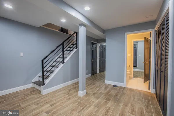 a bathroom with a shower and a sink