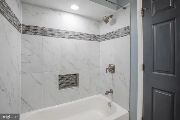 a bathroom with a sink a toilet and a bathtub