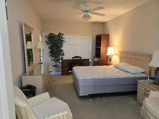 a bedroom with a bed and a couch
