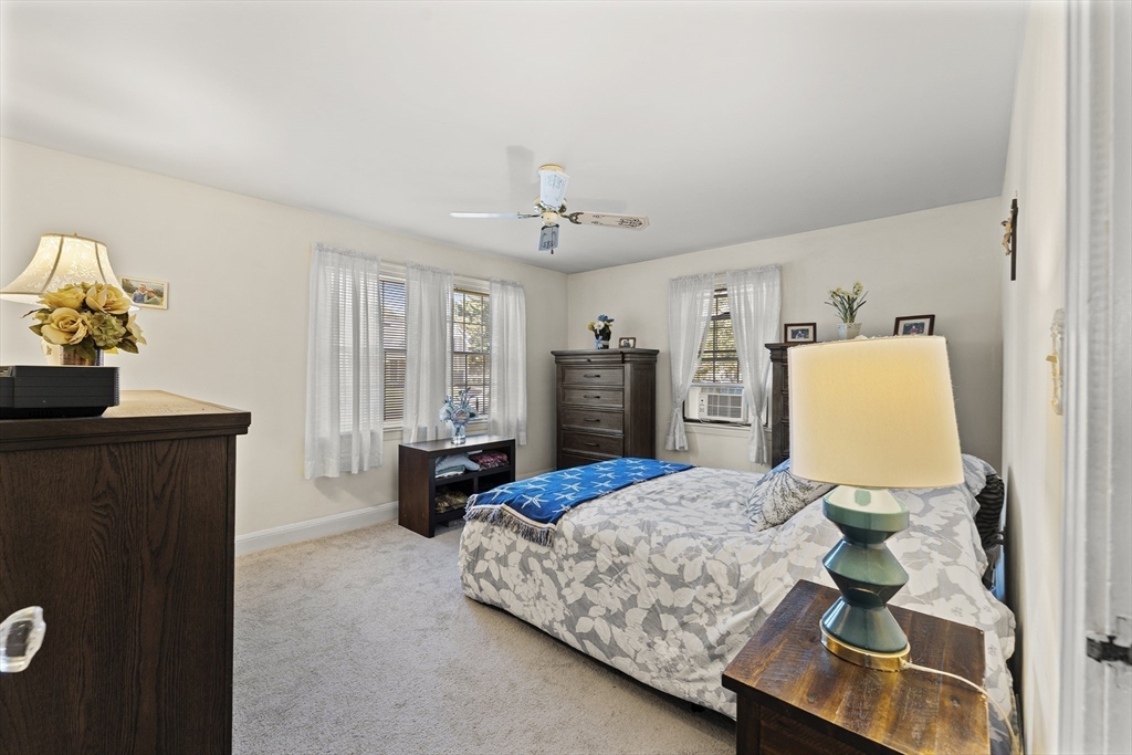 85 Oak Street Stoneham, MA 02180 - Photo 16 of 35 a bedroom with a bed dresser and a window