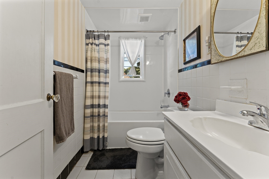 85 Oak Street Stoneham, MA 02180 - Photo 20 of 35 a bathroom with a sink a toilet and shower