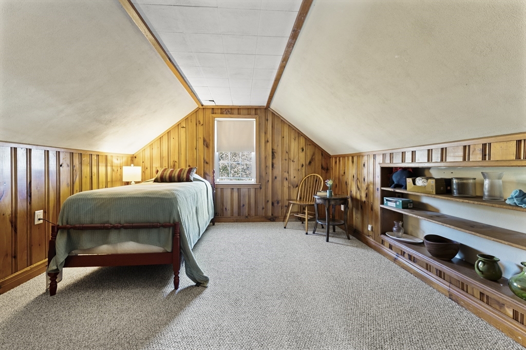 85 Oak Street Stoneham, MA 02180 - Photo 21 of 35 a bedroom with furniture and a book shelf