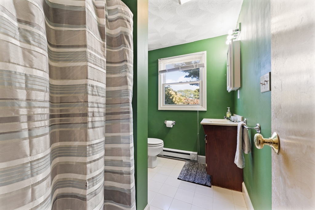 85 Oak Street Stoneham, MA 02180 - Photo 24 of 35 a bathroom with a toilet and a shower