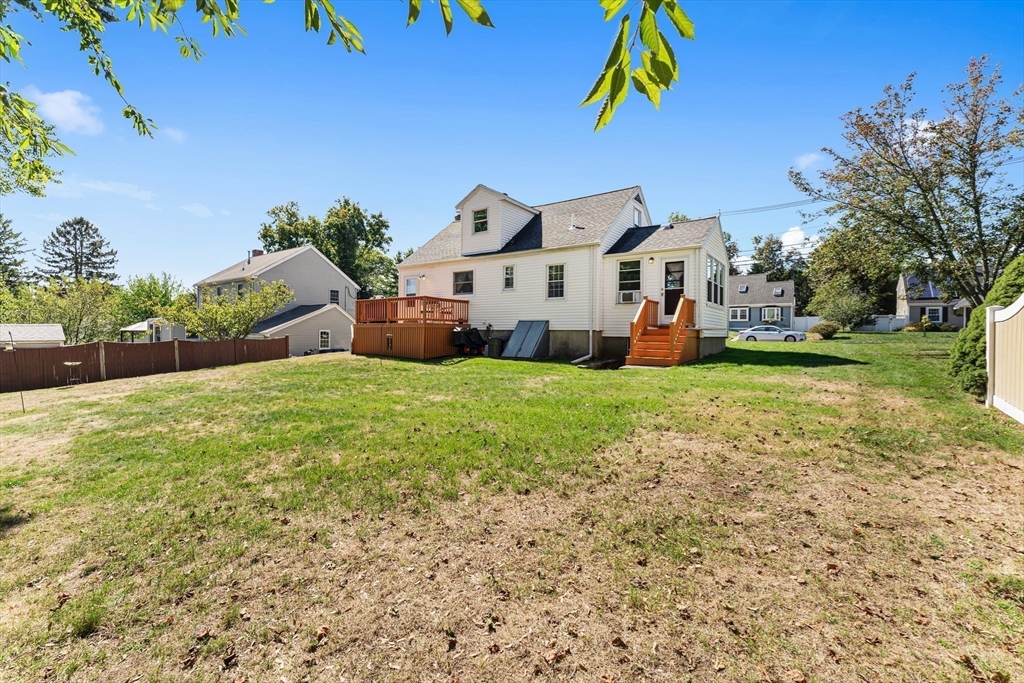 85 Oak Street Stoneham, MA 02180 - Photo 32 of 35 a view of a house with a yard and garage