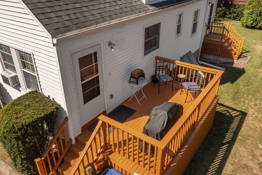85 Oak Street Stoneham, MA 02180 - Photo 33 of 35 a view of a patio with a table and chairs
