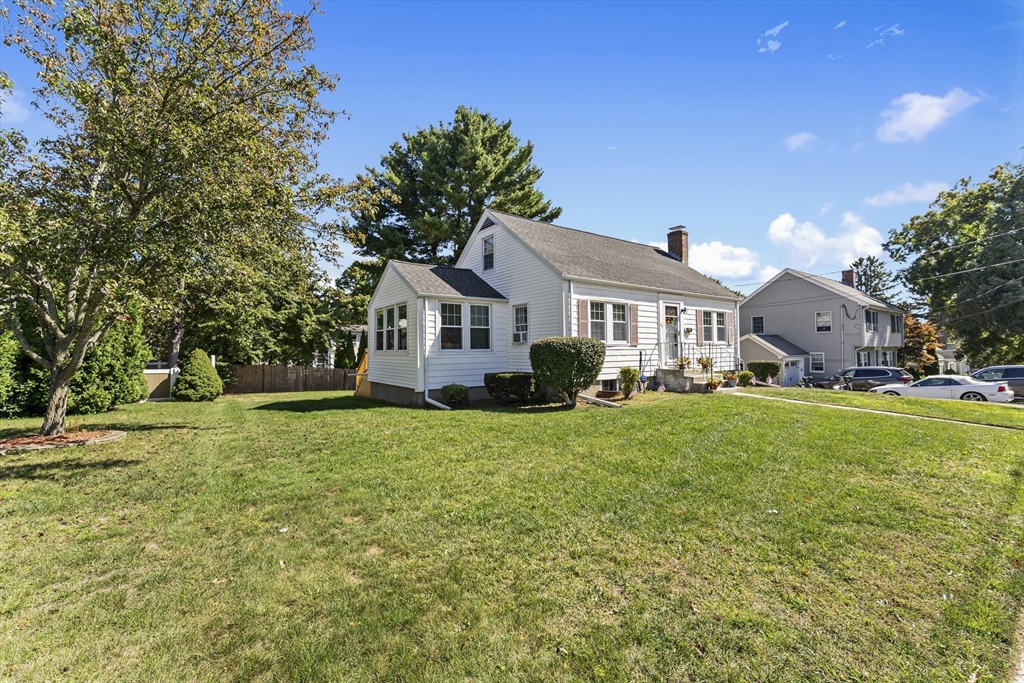 85 Oak Street Stoneham, MA 02180 - Photo 5 of 35 a front view of a house with a yard