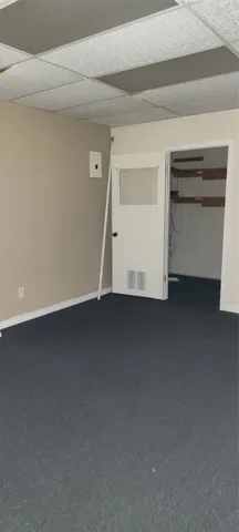 a view of room and a garage