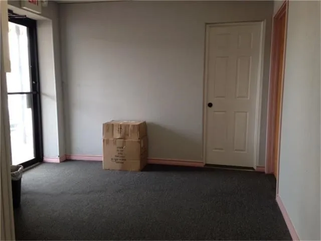 a view of an empty room and window